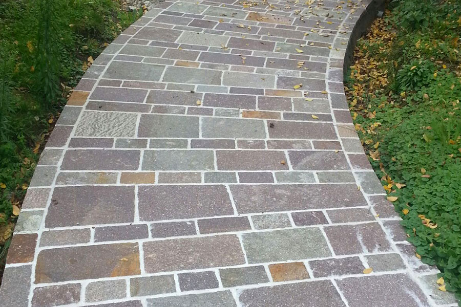 Paved walkway with porphyry tiles